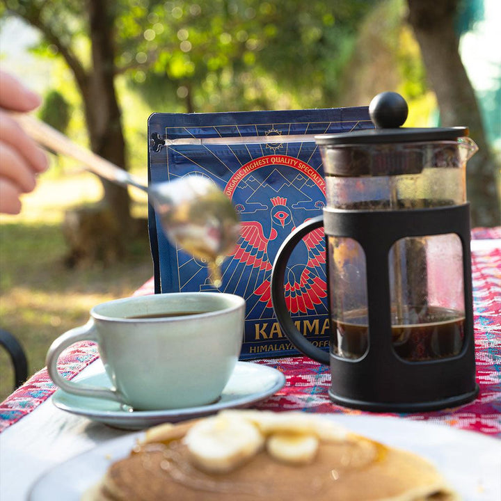 Kamma Dark Roast Himalayan Coffee with brewed coffee